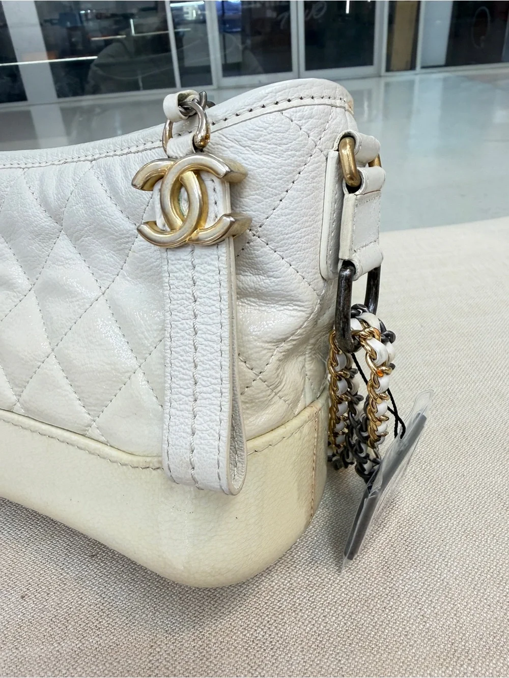 CHANEL White Quilted Leather Crossbody with Mixed Metal Chain and CC Charm